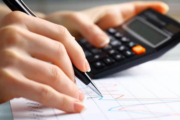 Person drawing a graph based on calculations