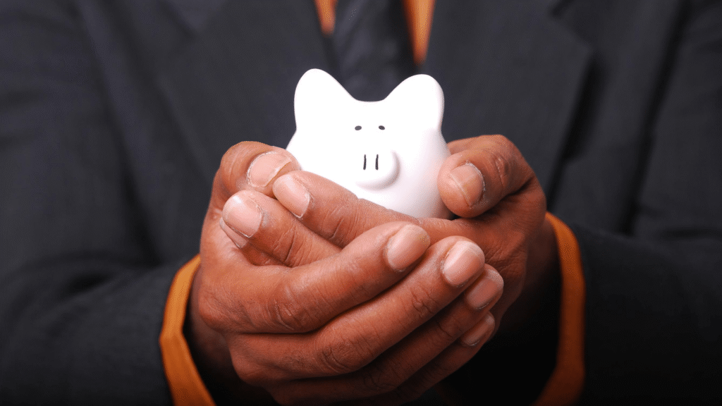 Hands holding a piggy bank