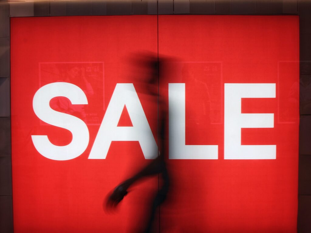 Image of a big red sale sign in a shop window